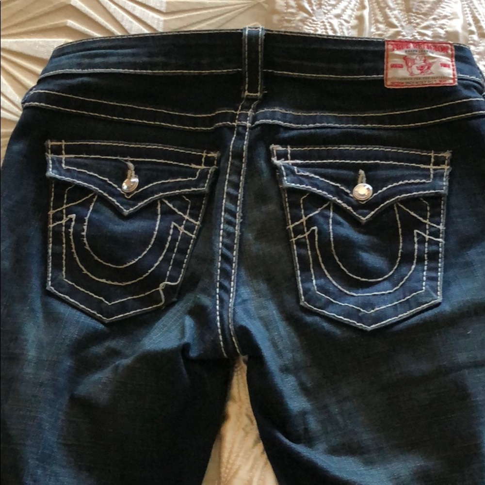 True Religion “jeweled” button jeans.